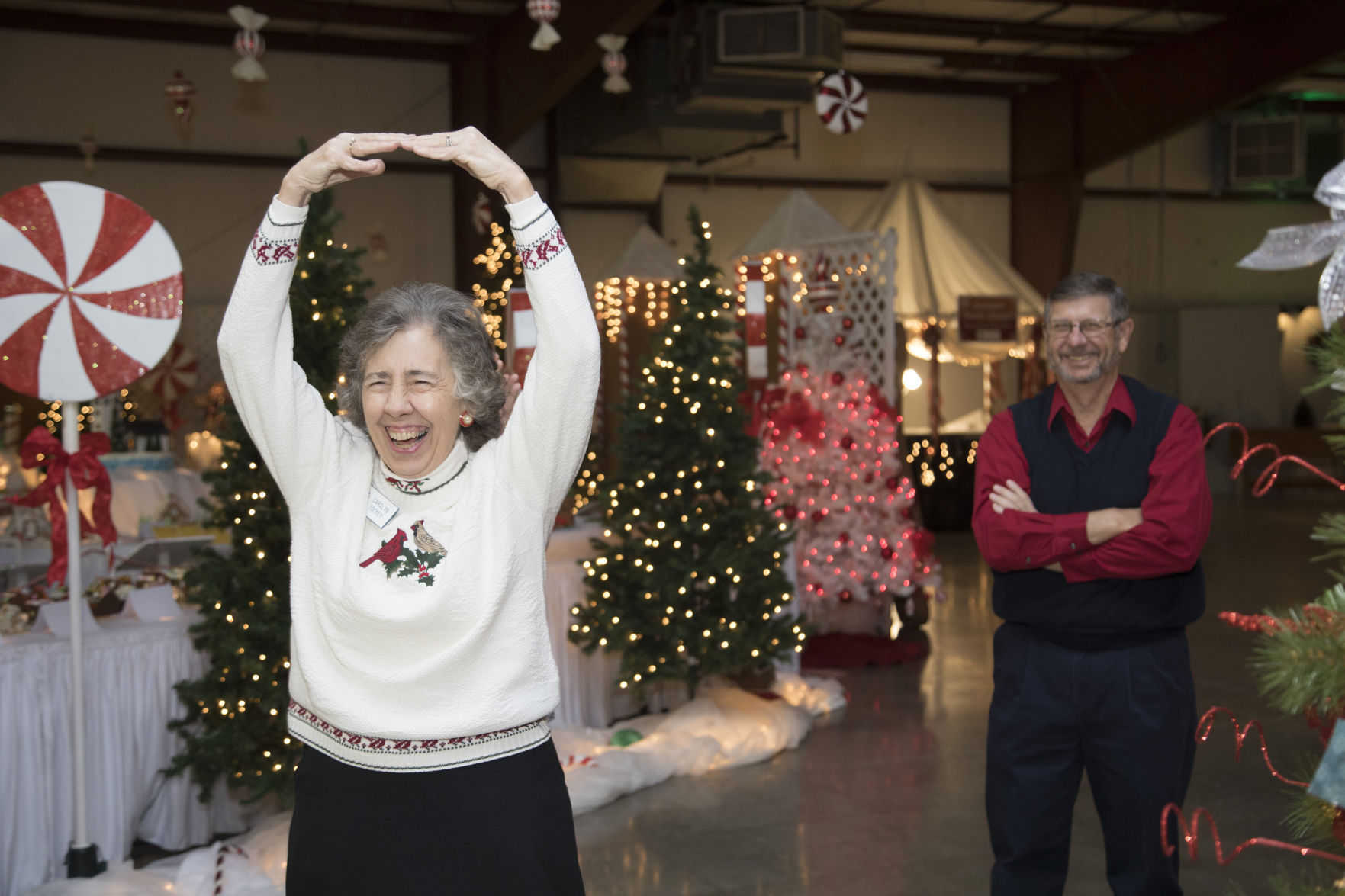 Carolyn Yockey doing her ballerina impression while Dennis Miller looks on